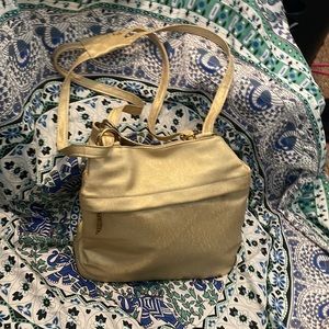 Gold purse by Merlin. Used only once. Like new no rips or stains